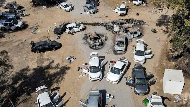 Abandoned and torched vehicles at the site of the October 7 attack on the Supernova desert music festival by Palestinian militants. Picture: Jack Guez/AFP