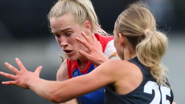 Celine Moody competes for the ball against the Blues. Picture: Kelly Defina/Getty Images