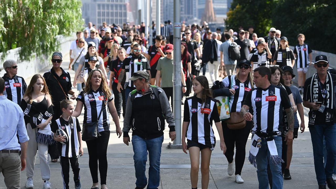 MELBOURNE, AUSTRALIA – APRIL 25: Fans arrive during the round six AFL match between Collingwood Magpies and Essendon Bombers at Melbourne Cricket Ground, on April 25, 2023, in Melbourne, Australia. (Photo by Quinn Rooney/Getty Images)