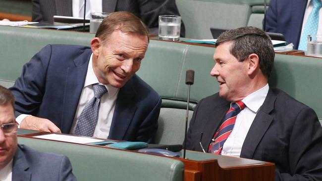 Former Prime Minister Tony Abbott chats with Kevin Andrews during Question Time. Andrews supports a citizenship audit. Picture Gary Ramage