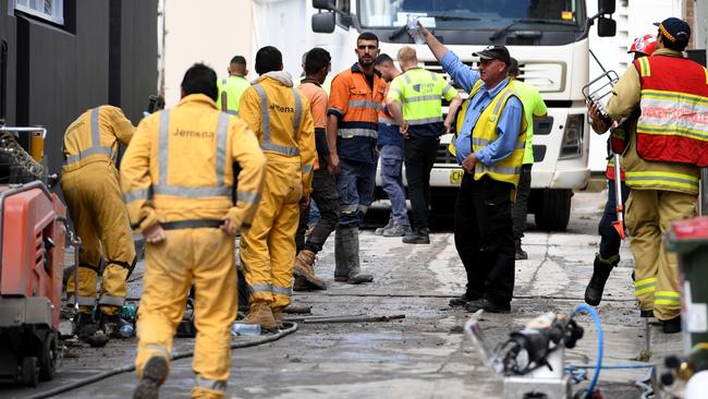 Workers and emergency crews at the site of a gas leak. Picture: Tracey Nearmy/Daily Telegraph