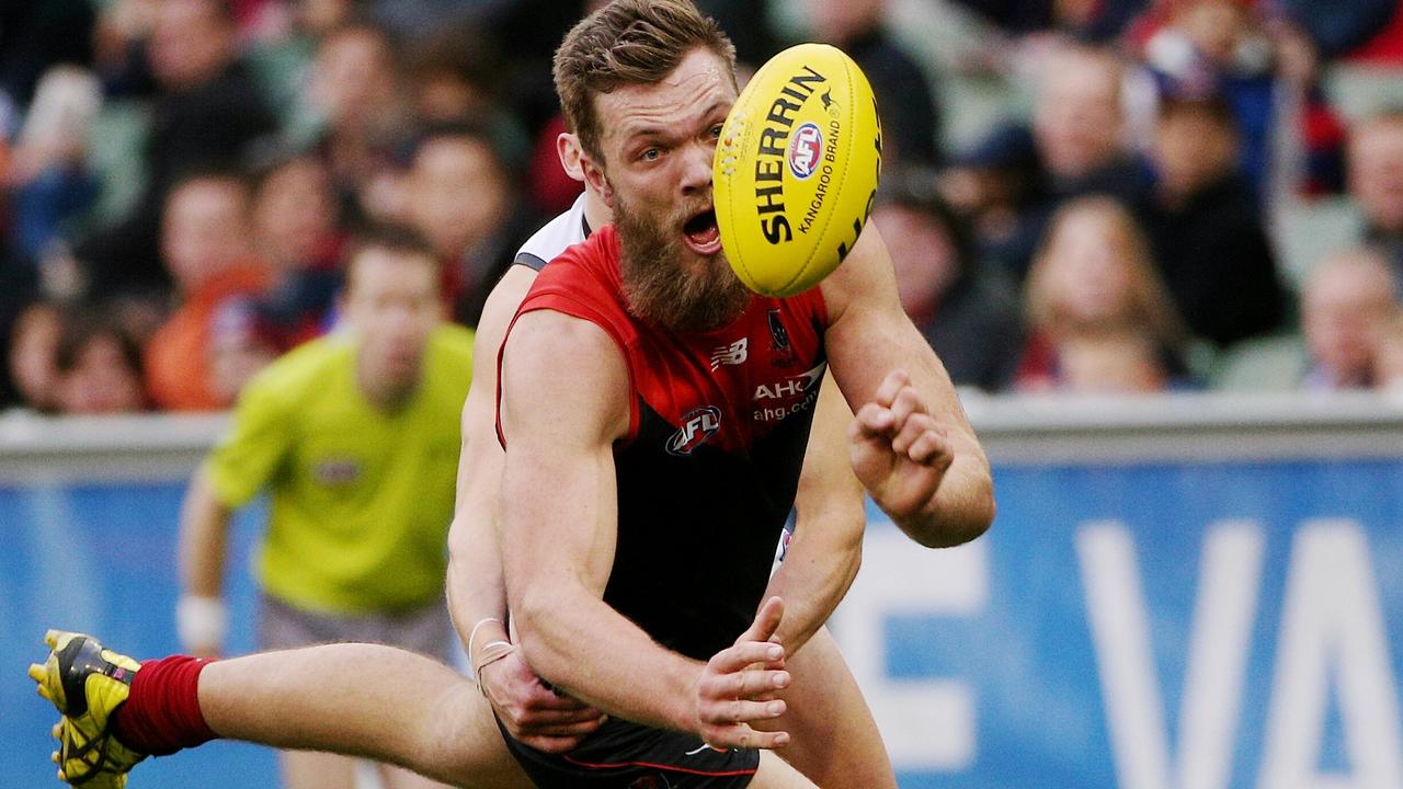 AFL- Melbourne v GWS at MCG, Melbourne. Max Gawn gets tackled. 17th August 2014. Picture: Colleen Petch.