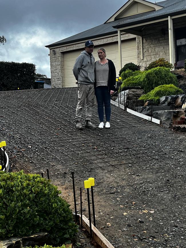 Craig and Paula Miels from Mount Barker are owed nearly $15k for their driveway that has been left half finished and unusable by Adelaide Exposed Concrete for more than three weeks. Picture: Supplied