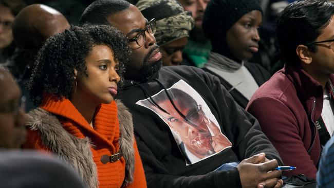 Rahiel Tesfamariam, left, and Raschaad Hoggard, both of New York, listen during comments as activists, actors, and politicians remember civil rights leader Malcolm X during a ceremony at the New York site in Harlem where he was killed 50 years ago Saturday, Feb. 21, 2015. (AP Photo/Craig Ruttle)