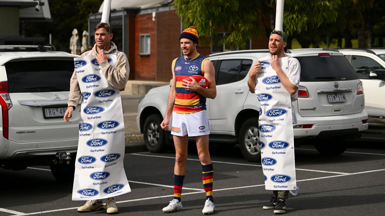 Tom Hawkins, Isaac Smith and Cameron Guthrie dressed up as Ben Keays and the goal posts from the recent goal review blunder. Picture: Morgan Hancock/AFL Photos