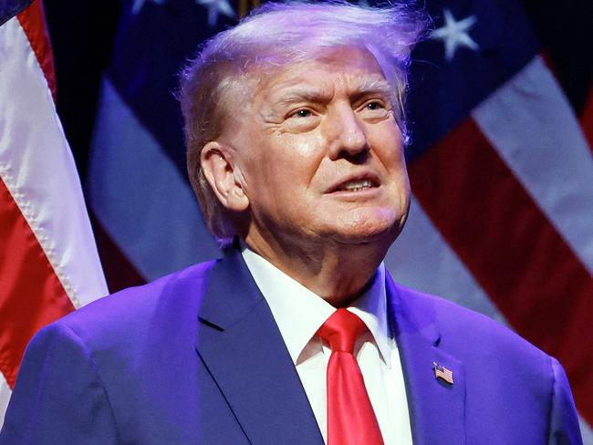 Former US President Donald Trump arrives on stage to speak about education policy at the Adler Theatre in Davenport, Iowa on March 13, 2023. (Photo by KAMIL KRZACZYNSKI / AFP)