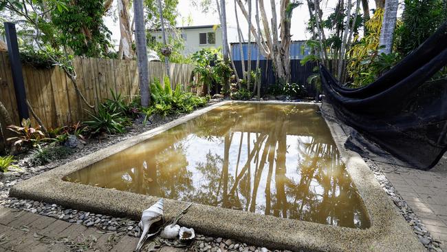 The flooded swimming pool at Chris Tress' home in Mimosa Street, Holloways Beach. The beachside suburb suffered widespread flooding this week when heavy rain from ex Tropical Cyclone Jasper caused the Barron River to breach its banks. Picture: Brendan Radke