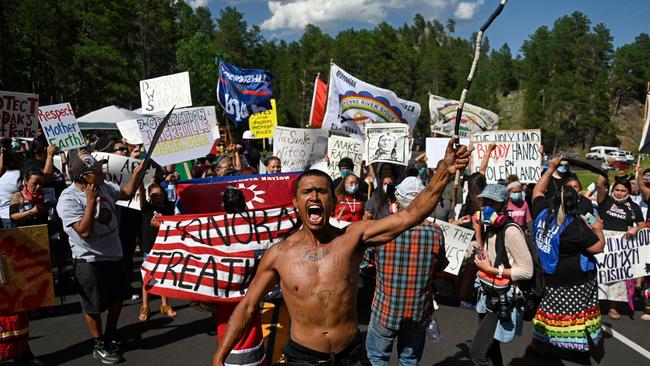 Activists and members of different tribes from the region block a road as they protest in Keystone, South Dakota a demonstration around the Mount Rushmore National Monument and a planned Fourth of July visit of US President Donald Trump. Picture: AFP