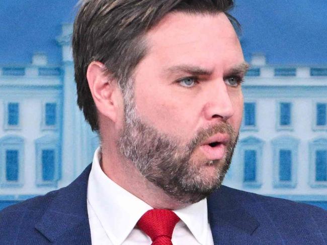 US President Donald Trump (R) looks on as Vice President JD Vance speaks about the mid-air crash between American Airlines flight 5342 and a military helicopter in Washington, in the Brady Press Briefing Room at the White House on January 30, 2025 in Washington, DC. Divers pulled bodies from the icy waters of Washington's Potomac river Thursday after a US military helicopter collided midair with a passenger plane carrying 64 people, with officials saying there were likely no survivors. (Photo by ROBERTO SCHMIDT / AFP)