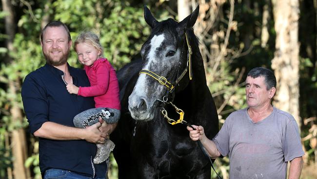 Racehorse owner Chris Jorgensen and his daughter Athena with his horse Taveuni and Cairns Trainer Rodney Miller. PICTURE: STEWART MCLEAN.