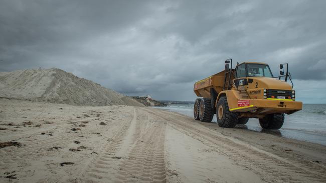 Heavy machinery used to cart sand to West Beach to fix erosion. Picture: Brad Fleet