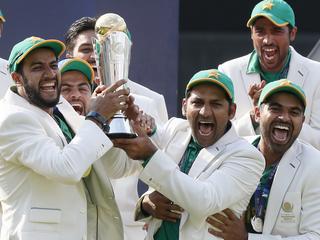 Pakistan's captain Sarfraz Ahmed, front center, celebrates with teammates during the award ceremony for the ICC Champions Trophy at The Oval in London, Sunday, June 18, 2017. Pakistan won the final by crushing India for 180 runs. (AP Photo/Kirsty Wigglesworth)