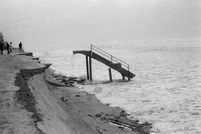 Beach stairs exposed and damaged by severe erosion, Mermaid Beach, Queensland, 1967. Source: Gold Coast Libraries Local Studies Collection.