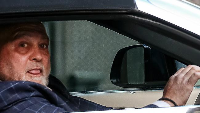 Mick Gatto leaves his solicitor’s office after appearing over Zoom in a defamation trial he has brought against the ABC for reporting allegations he is a murderer, had threatened to kill Lawyer X Nicola Gobbo, and is one of Australia’s most violent criminals. Picture : NCA NewsWire / Ian Currie