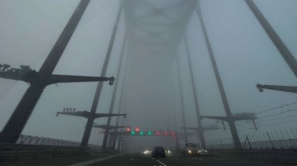The Sydney Harbour Bridge covered in a thick fog. Picture: Instagram/klr_redv6