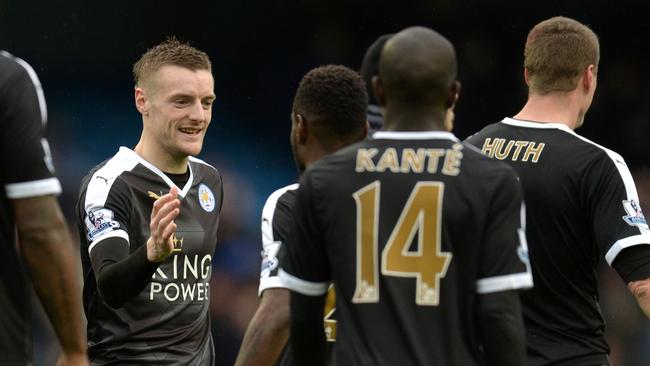 Leicester City's Jamie Vardy (left) congratulates teammates after beating Manchester City away last weekend. Picture: AFP.