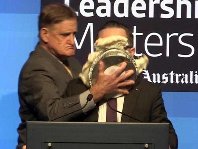 Qantas CEO Alan Joyce has cream pie on his face after being attacked by a man who came from back stage while addressing a West Leadership Matters breakfast. Picture: The West Australian