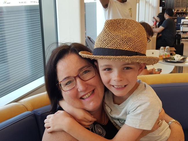 Anna Ramsay and son Hamish have also been affected by the internet outage in Summer Hill