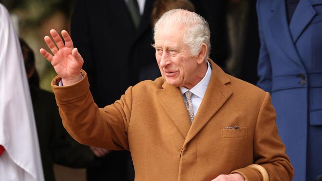 (FILES) Britain's King Charles III waves to wellwishers after attending the Royal Family's traditional Christmas Day service at St Mary Magdalene Church on the Sandringham Estate in eastern England on December 25, 2023. Britain's King Charles III admitted to hospital for prostrate surgery, Buckingham Palace said in a statement on January 26, 2024. (Photo by Adrian DENNIS / AFP)