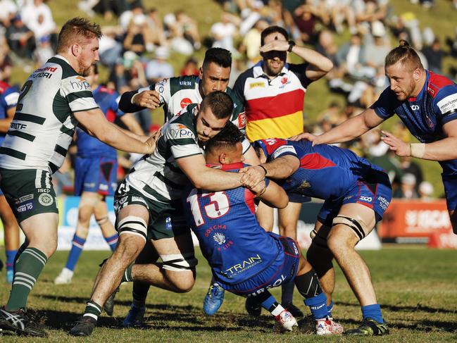 Warringah’s Luke Reimer tackles Manly’s Dennis Pili-Gaitau. Picture: Karen Watson