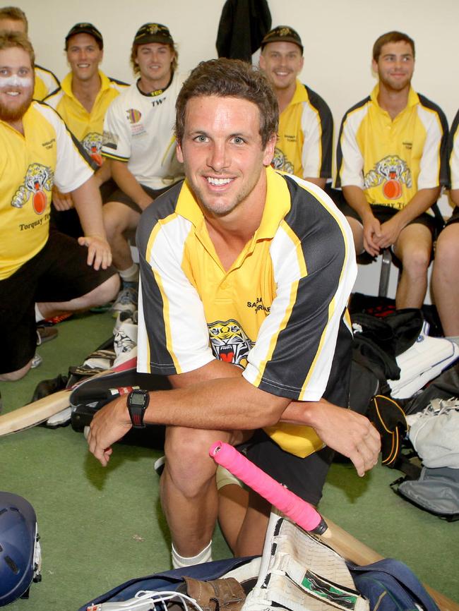 Travis Boak with Torquay teammates before a cricket match in 2013.