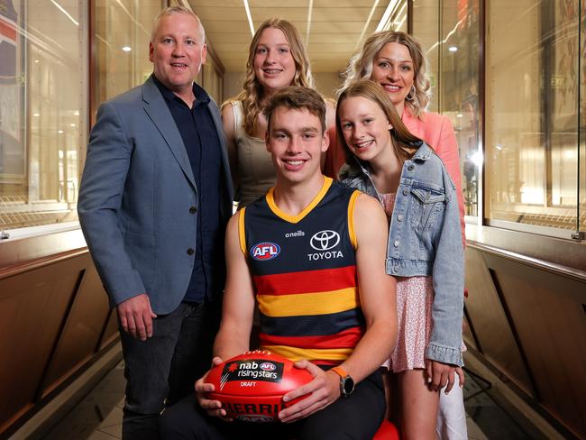 Riley Thilthorpe with his family after being recruited by the Crows.