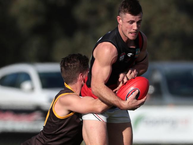 Jonathan McCumber-Kelly of Thomastown tackles Bradyn Taglieri of Eltham during the NFL football match between Thomastown and Eltham played at Main Street Reserve, Thomastown on Saturday 2nd June, 2018.