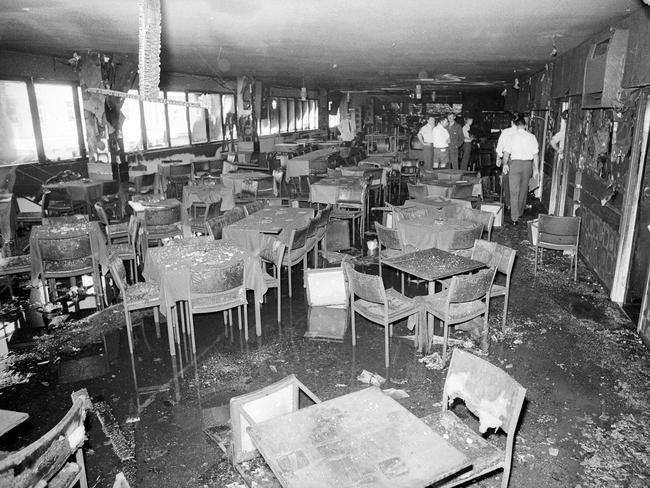 Detectives comb the interior of the burnt-out Whiskey Au Go Go in 1973.