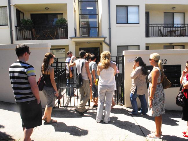 Group of prospective tenants queue outside a complex to inspect a one bedroom apartment in Clovelly, Sydney.