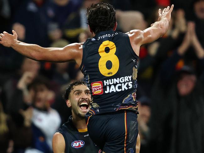 Rachele celebrates with Izak Rankine. (Photo by Sarah Reed/AFL Photos via Getty Images)