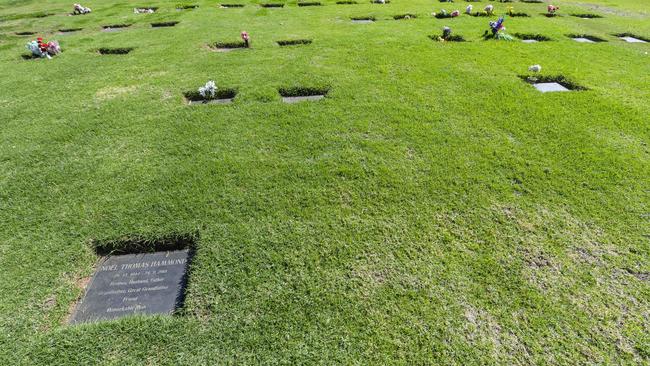 The unmarked grave of Margaret Varcoe, 27-year-old sister of former Collingwood player Travis Varcoe, in Smithfield Memorial Park. Ms Varcoe’s plot is to the right of this plaque. Picture: Roy VanDerVegt