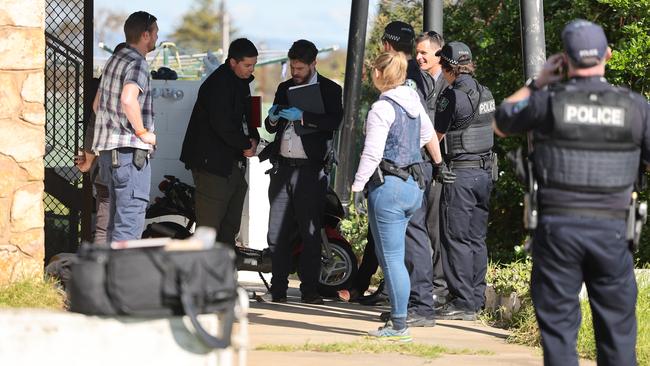 Detectives and police outside the property in Christies Beach. Picture: NCA NewsWire / David Mariuz