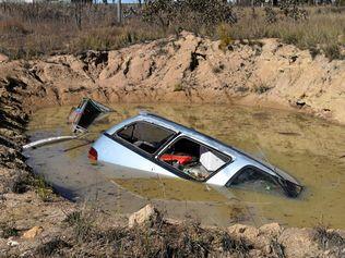 Car in dam at corner of Neilsen Road and Sugarloaf Road,  Stanthorpe. Picture: DEIRDRE SMITH