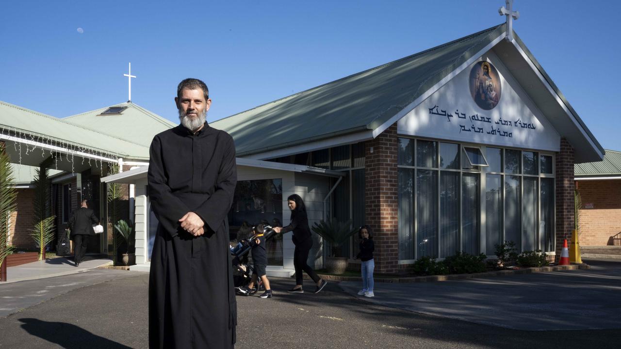 Daniel Kochou Secretary to the bishop priest poses for a photo before Sunday Morning Mass at The Good Shepherd Church, Wakeley. Picture: Monique Harmer