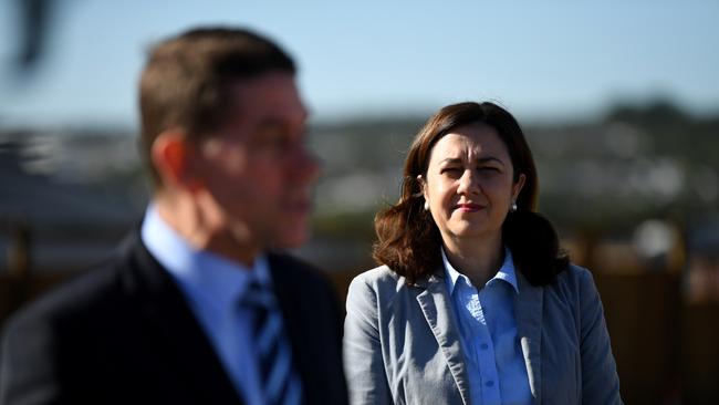 Queensland Premier Annastacia Palaszczuk stands by Treasurer Cameron Dick as he addresses media during a visit to a Spring Mountain construction site in Brisbane on Monday. Picture: AAP