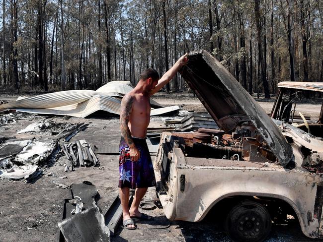 SYDNEY, AUSTRALIA - NOVEMBER 13: Danny Wearne surveys the bushfire damage to his property on November 13, 2019 in Rainbow Flat, Australia. Catastrophic fire conditions - the highest possible level of bushfire danger - have eased across greater Sydney, Illawarra and Hunter areas thanks to a slight cool change, however dozens of bushfires are still burning. A state of emergency, as declared by NSW Premier Gladys Berejiklian on Monday, is still in effect, giving emergency powers to Rural Fire Service Commissioner Shane Fitzsimmons and prohibiting fires across the state. (Photo by Sam Mooy/Getty Images)