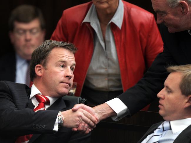 State of the State address reply, Parliament House, Hobart, from left, Leader of the Opposition (Liberal leader) Will Hodgman, left, is congratulated by his father Michael Hodgman, top right, after his speech