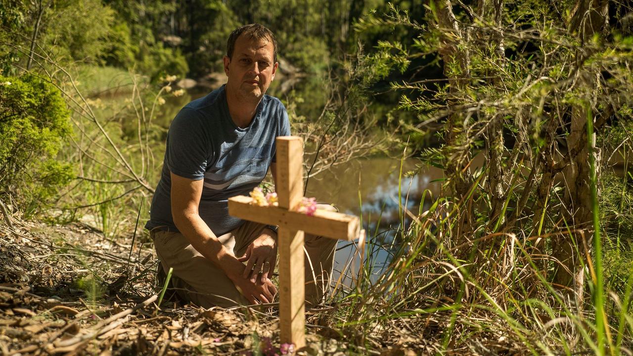 Peter Hallet with a cross for Melissa at Burrenjim Dam. Picture: NSW Police