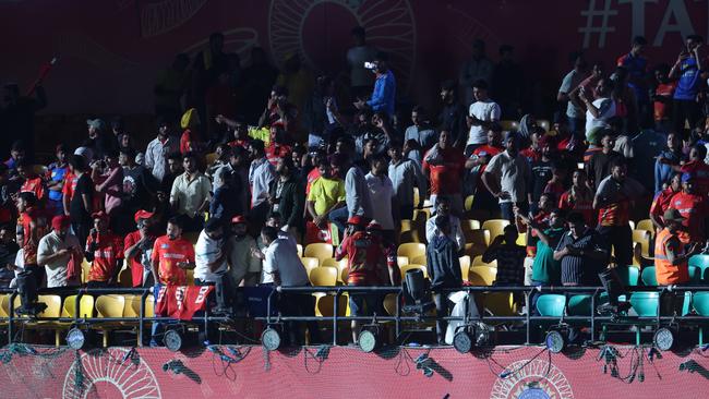 Spectators leave the stands after authorities evacuated the stadium during the 2025 IPL match between Punjab Kings and Delhi Capitals in Dharamsala, India. (Photo by Pankaj Nangia/Getty Images)