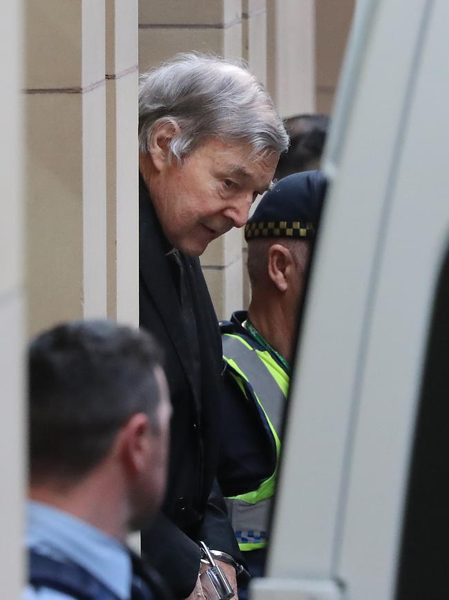 Pell is led away in a prison van after losing his appeal. Picture: Alex Coppel