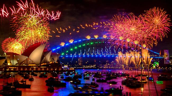 Fireworks explode over the Sydney Harbour Bridge and Sydney Opera House at midnight on January 1, 2024. Trains will run 46 hours straight to allow Sydneysiders to see the new year’s fireworks. Picture: Izhar Khan/AFP