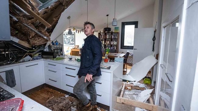 Leigh Burgess surveys the damage to his home. Picture: Jason Edwards.