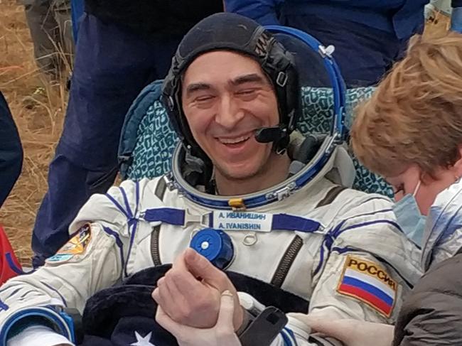 Russian cosmonaut Anatoly Ivanishin gets medical check shortly after landing in a remote area outside the town of Dzhezkazgan (Zhezkazgan), Kazakhstan, on October 22, 2020. - An American astronaut and two Russian cosmonauts touched down safely on the Kazakhstan steppe on October 22, completing a 196-day mission that began with the first launch under lockdown conditions. (Photo by Handout / Rosaviatsiya / AFP) / RESTRICTED TO EDITORIAL USE - MANDATORY CREDIT "AFP PHOTO / Rosaviatsiya / handout " - NO MARKETING - NO ADVERTISING CAMPAIGNS - DISTRIBUTED AS A SERVICE TO CLIENTS