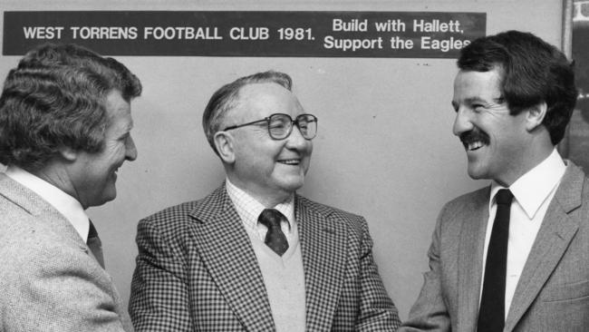 West Torrens coach Glenn Elliott (right) is welcomed by chairman Peter Livesey (left) and Albert Shergold of Hallett Brick Industries in November 1981.