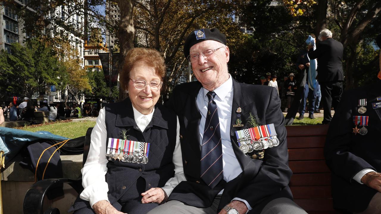 Pat Johnson with her father’s medals and husband Ross Johnson, who was an patrol officer in Papua New Guinea at the Anzac Day march in Sydney last year. Picture: Tim Hunter.