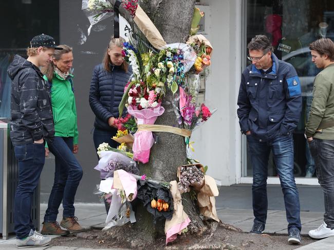 Family and friends of Gitta Scheenhouwer visit the floral memorial in Chapel St, South Yarra.  Picture: David Crosling