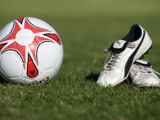 Generic soccer ball and football boots.