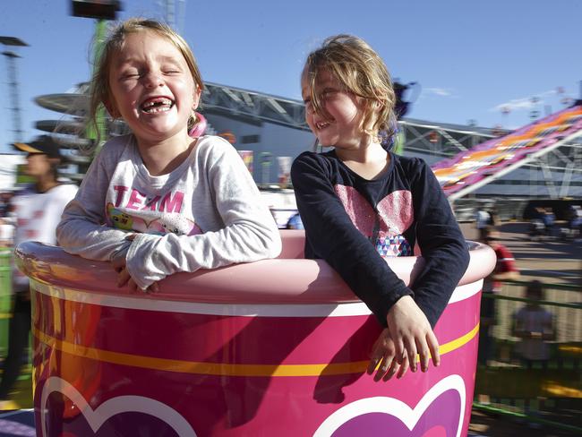 Willow and Faith Evans, are loving the award-winning Royal Tea Cups ride. Picture: Justin Lloyd