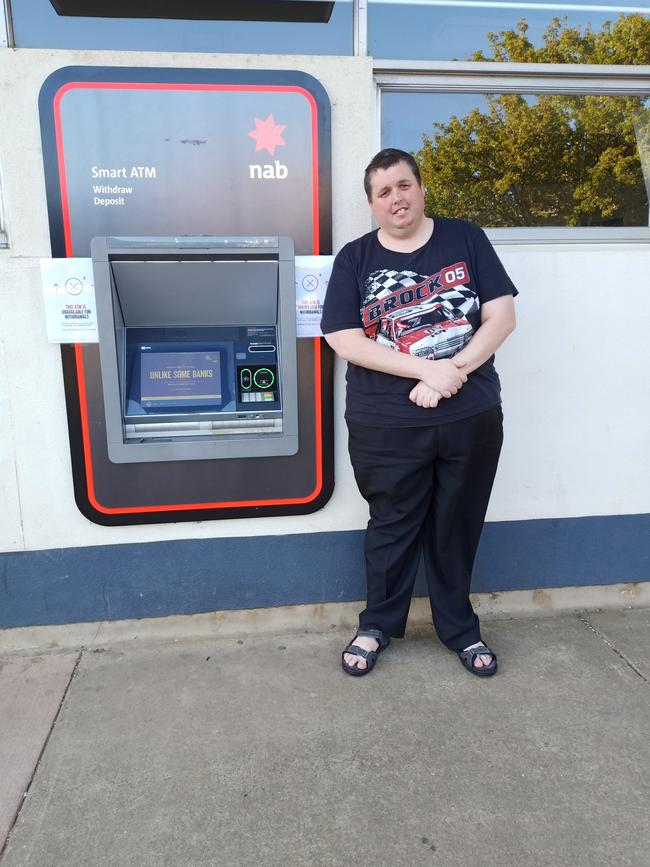 Tatura's Jason Jones in front of the NAB ATM.