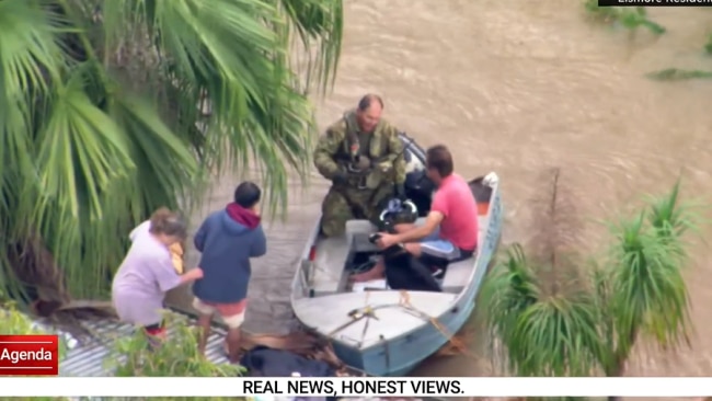 After about two minutes the rescue soldier finally made it up onto a boat next to the house. Picture: Supplied.
